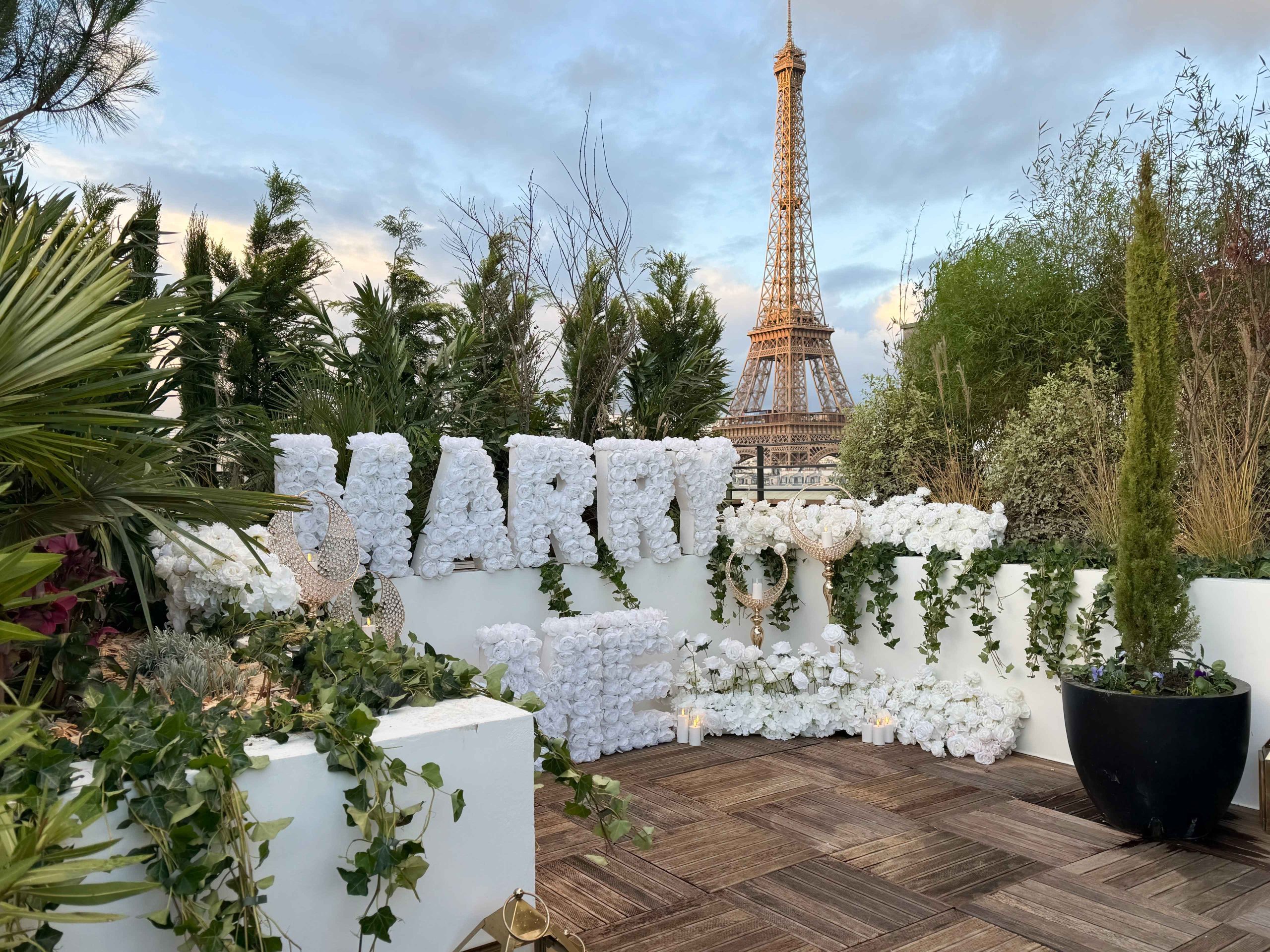 Paris proposal package with Marry Me letters, photographer, and private rooftop Eiffel Tower view