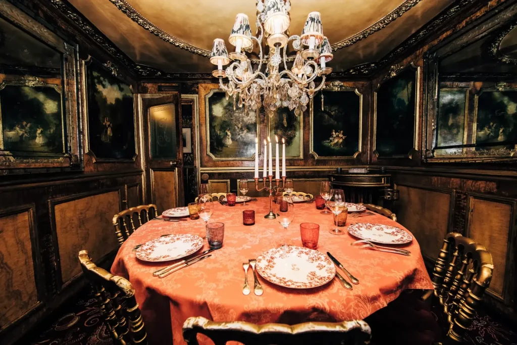 Velvet-lined private salon at Lapérouse restaurant in Paris with diamond-scratched mirrors