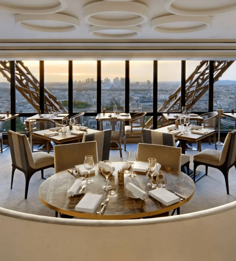 Dining room at Le Jules Verne inside the Eiffel Tower with floor-to-ceiling views over Paris