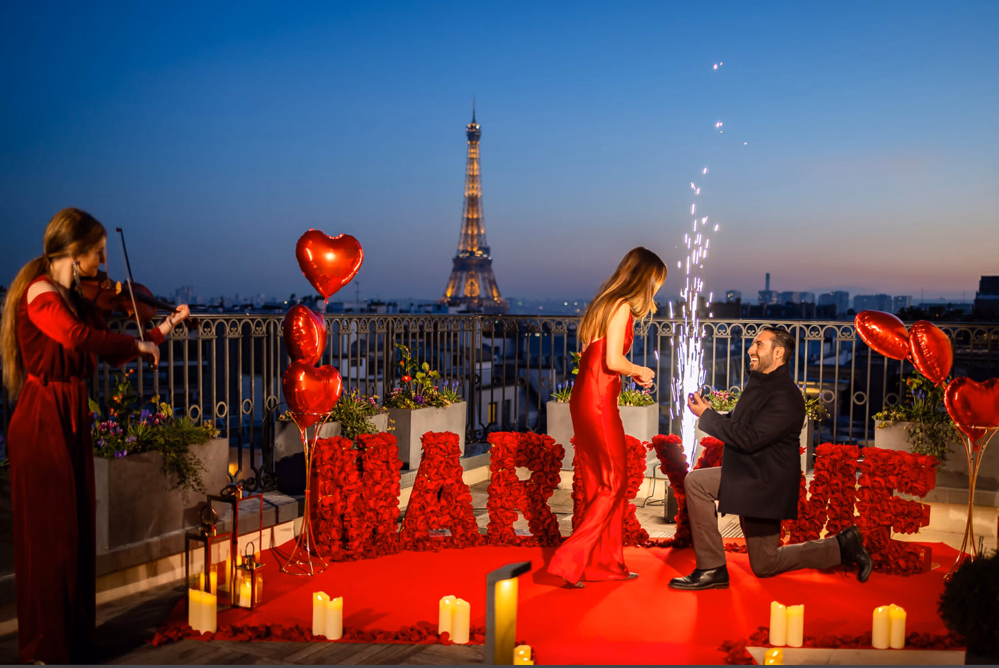 Paris proposal package at The Peninsula Paris rooftop with marry me letters, red heart balloons and Eiffel Tower proposal at sunset